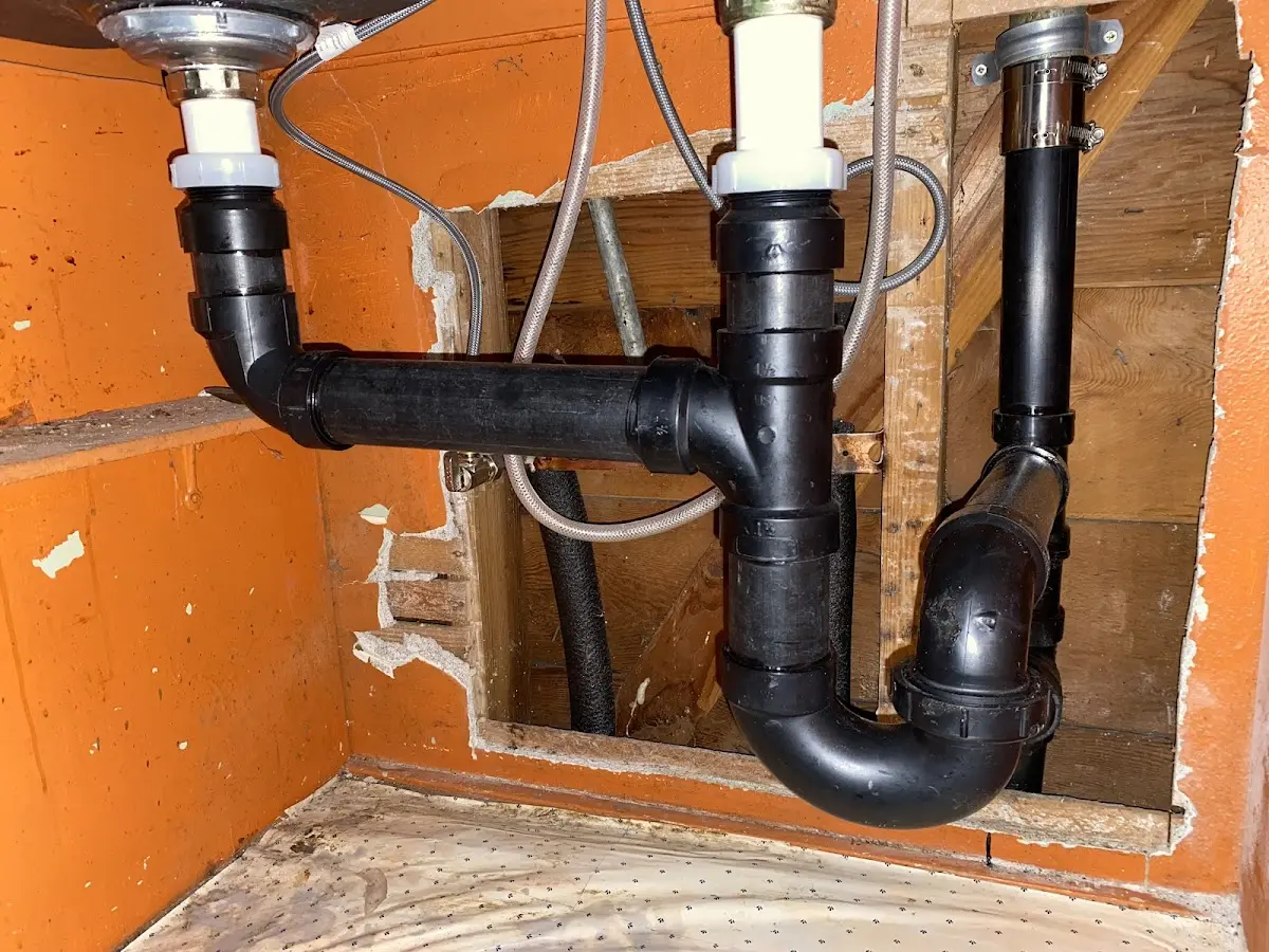 Professional Garbage Disposal Repair equipment and tools on the job in Hope Mills